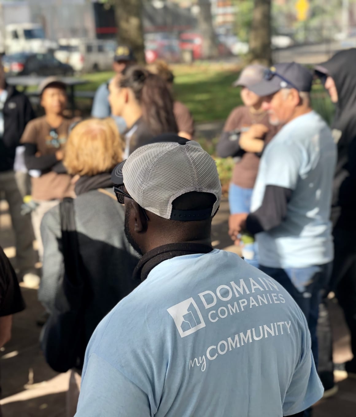 Domain employees working togtehr on a service project outside