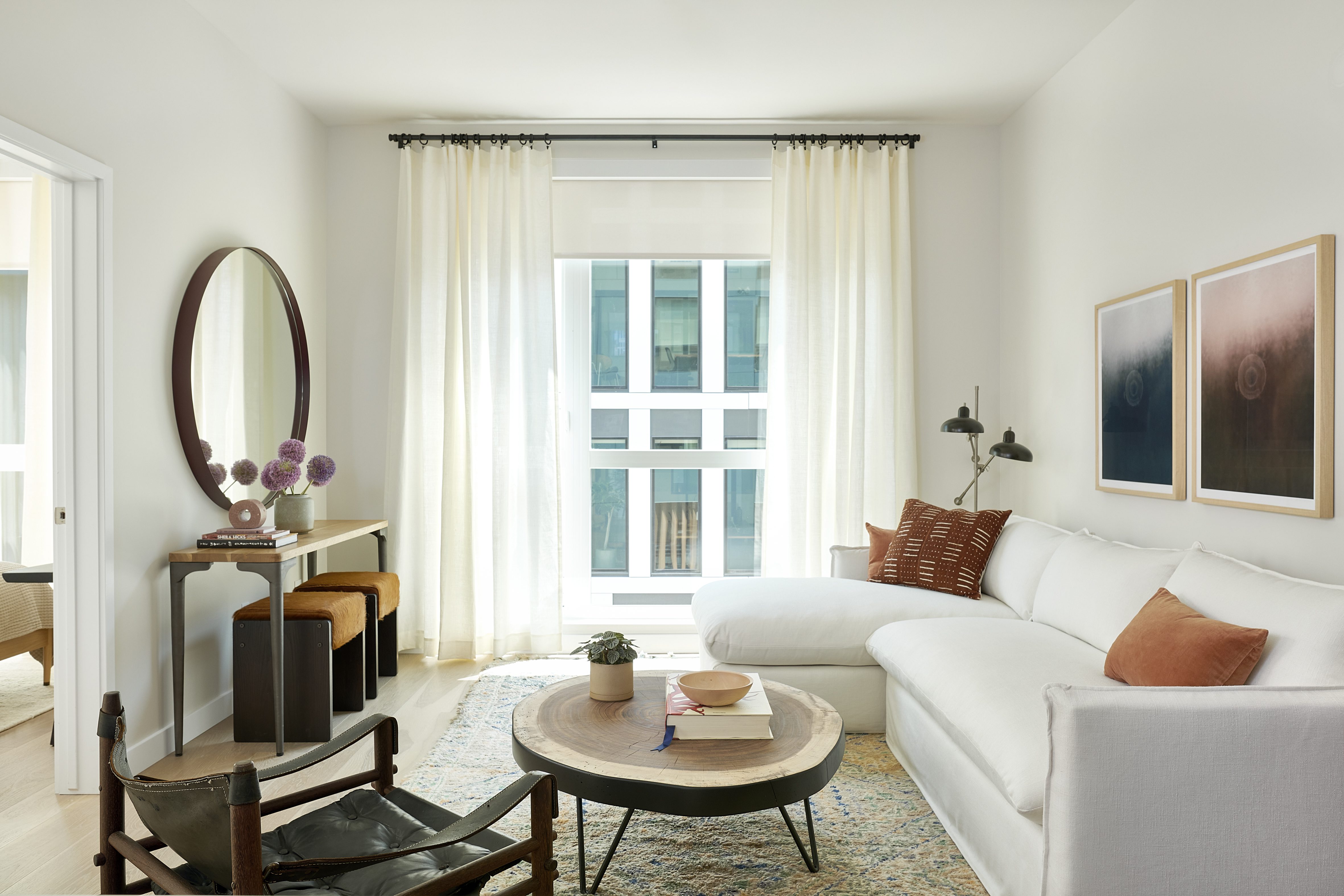 Living Room with a large window generously pouring light into the space